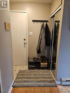 Entry/Foyer of the unit w/closet, tile flooring - 
