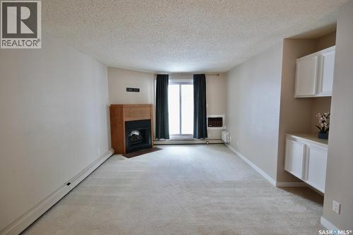 210 207C Tait Place, Saskatoon, SK - Indoor With Fireplace