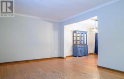 Room features include crown moulding & hardwood - 