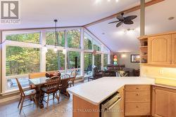 Kitchen also looks at woods via same prow windows - 