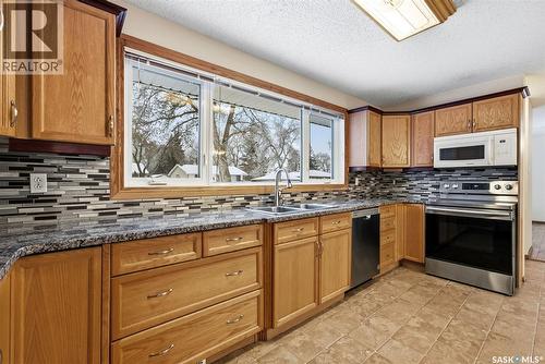 14 Milford Crescent, Regina, SK - Indoor Photo Showing Kitchen With Double Sink