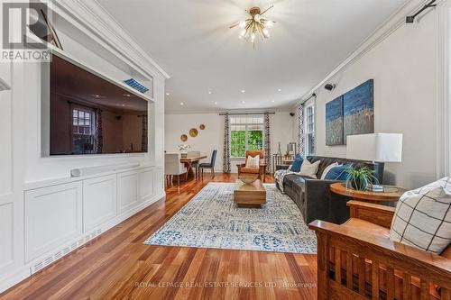 Living Room Highlighted by a Woodburning Fireplace - 335 Lakeshore Road W, Oakville, ON - Indoor Photo Showing Living Room