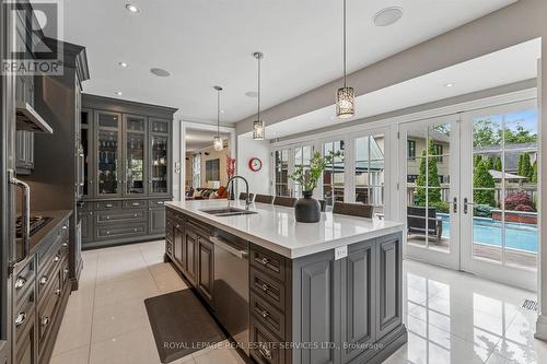 The Dream Kitchen Showcases Granite Countertops - 335 Lakeshore Road W, Oakville, ON - Indoor Photo Showing Kitchen With Double Sink With Upgraded Kitchen