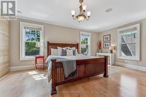 The Primary Bedroom Features a Walk-In Closet - 335 Lakeshore Road W, Oakville, ON - Indoor Photo Showing Bedroom