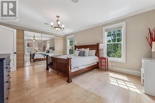 Bright Primary Bedroom Offering Hardwood Flooring - 335 Lakeshore Road W, Oakville, ON - Indoor Photo Showing Bedroom