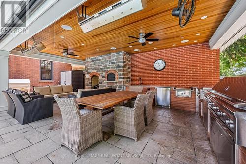 Enjoy a Woodburning Fireplace and Pizza Oven - 335 Lakeshore Road W, Oakville, ON - Outdoor With Deck Patio Veranda With Exterior