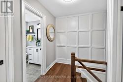 Upstairs hallway with wainscoting accent wall. - 