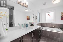 Private ensuite bathroom with deep soaker tub - 