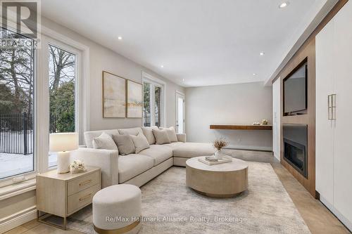 Family room-virtually staged - 1188 Carey Road, Oakville (Mo Morrison), ON - Indoor Photo Showing Living Room With Fireplace