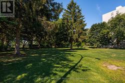 Open Tree-lined Grass Area adjacent to pool. - 