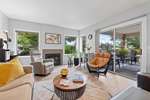 115-3335 Richter Street, Kelowna, BC - Indoor Photo Showing Living Room With Fireplace