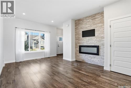 966 Mcfaull Manor, Saskatoon, SK - Indoor Photo Showing Living Room With Fireplace