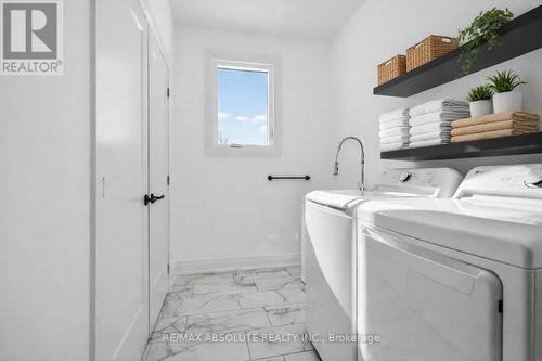 Virtually staged laundry room - 989 William Mooney Road, Ottawa, ON - Indoor Photo Showing Laundry Room
