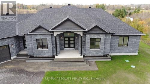 House in autumn (interlock in the front) - 989 William Mooney Road, Ottawa, ON - Outdoor With Facade
