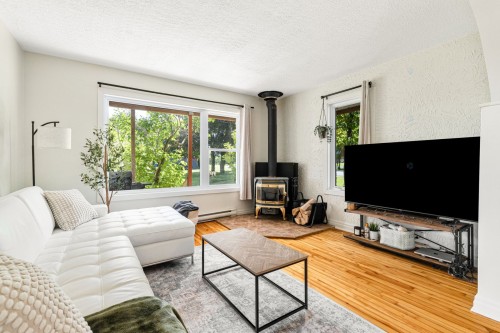Salon - 3395 Ch. Ste-Thérèse, Carignan, QC - Indoor Photo Showing Living Room With Fireplace