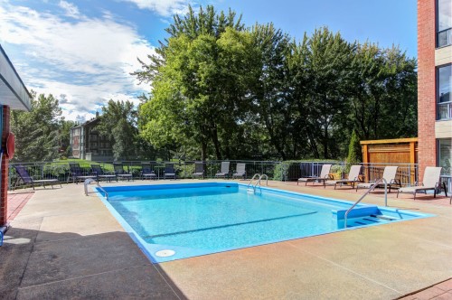Pool - 506-4460 Ch. Des Cageux, Laval (Chomedey), QC - Outdoor With In Ground Pool With Backyard