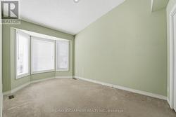 Main Floor Second Bedroom with Vaulted Ceiling - 