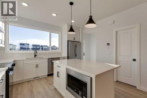 371 Fireside Drive, Cochrane, AB - Indoor Photo Showing Kitchen With Upgraded Kitchen