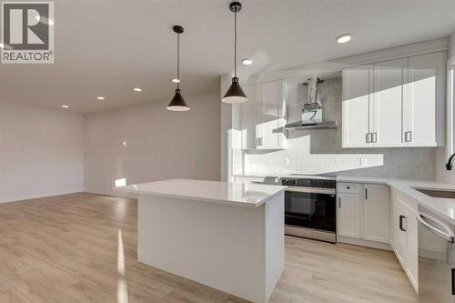 371 Fireside Drive, Cochrane, AB - Indoor Photo Showing Kitchen With Upgraded Kitchen