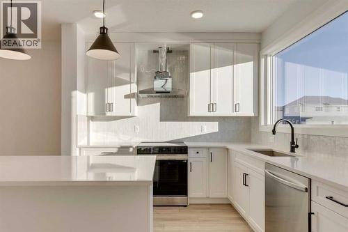371 Fireside Drive, Cochrane, AB - Indoor Photo Showing Kitchen With Upgraded Kitchen