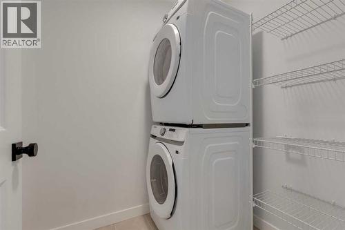371 Fireside Drive, Cochrane, AB - Indoor Photo Showing Laundry Room