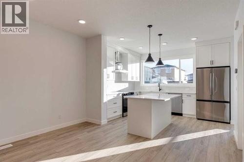 371 Fireside Drive, Cochrane, AB - Indoor Photo Showing Kitchen With Upgraded Kitchen