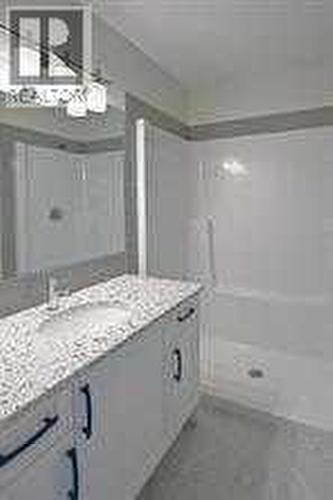 ensuite bath, tile floor, quartz vanity top, 5ft walk in shower - 253 Cobblestone Gate Sw, Airdrie, AB - Indoor