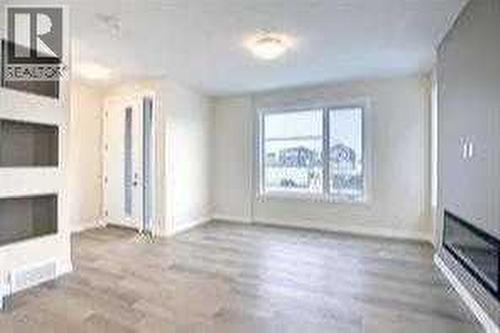 greatroom, fireplace optional - 253 Cobblestone Gate Sw, Airdrie, AB - Indoor With Fireplace