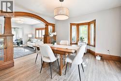 Dining Room With Bay Window, Rich Wood Trim - 