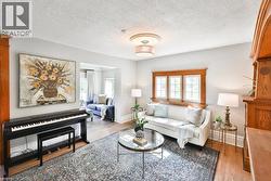 Living Room Open To Den, Large Windows - 