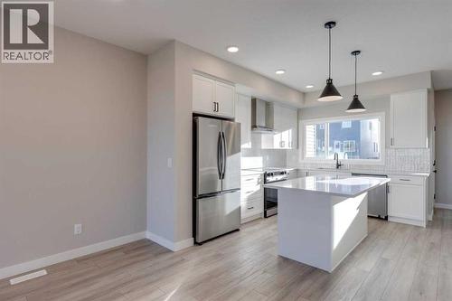 315 Fireside Drive, Cochrane, AB - Indoor Photo Showing Kitchen With Upgraded Kitchen