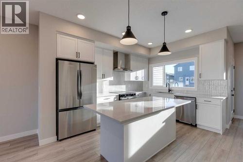 315 Fireside Drive, Cochrane, AB - Indoor Photo Showing Kitchen With Upgraded Kitchen