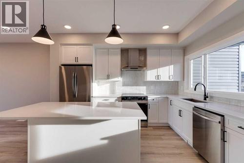 315 Fireside Drive, Cochrane, AB - Indoor Photo Showing Kitchen With Upgraded Kitchen