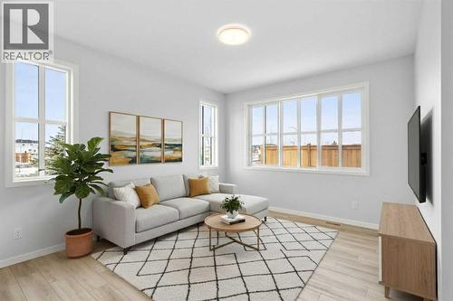 Virtually Staged - 659 Buffaloberry Manor Se, Calgary, AB - Indoor Photo Showing Living Room