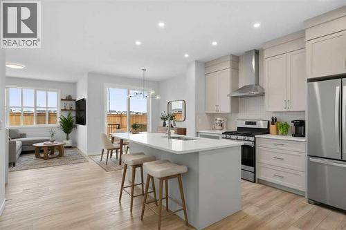 Virtually Staged - 659 Buffaloberry Manor Se, Calgary, AB - Indoor Photo Showing Kitchen With Upgraded Kitchen
