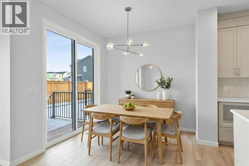 Virtually Staged - 659 Buffaloberry Manor Se, Calgary, AB - Indoor Photo Showing Dining Room