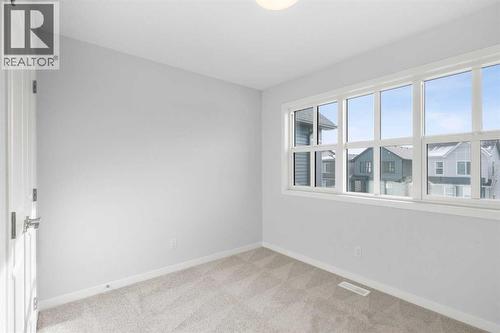 659 Buffaloberry Manor Se, Calgary, AB - Indoor Photo Showing Other Room