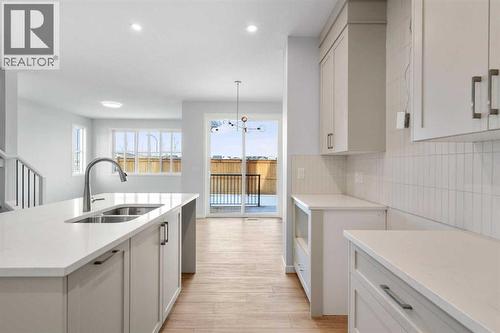 659 Buffaloberry Manor Se, Calgary, AB - Indoor Photo Showing Kitchen With Double Sink