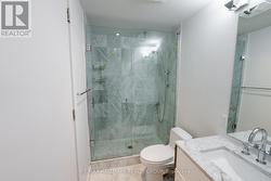 Spa Inspired Bathroom with Marble and Glass Shower - 