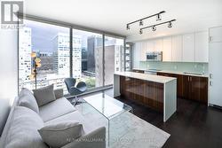 Living Room & Kitchen w/Floor to Ceiling Windows - 