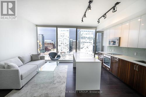 Living Room & Kitchen w/Floor to Ceiling Windows - 1502 - 300 Lisgar Street, Ottawa, ON - Indoor Photo Showing Kitchen