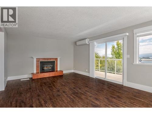 3940 Angus Drive, West Kelowna, BC - Indoor Photo Showing Living Room With Fireplace