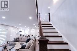 Stairs with hardwood / wood-style floors - 