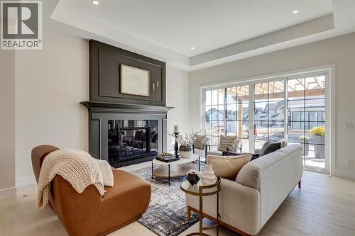 11 Normandy Lane Sw, Calgary, AB - Indoor Photo Showing Living Room With Fireplace
