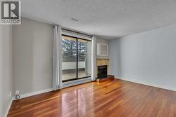 Living room with patio doors leading out to balcony - 