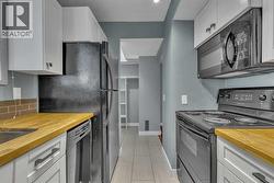 Kitchen with over the range microwave hood fan - 