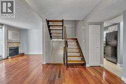 Stairs leading to lower level entry and upper floor bedrooms - 
