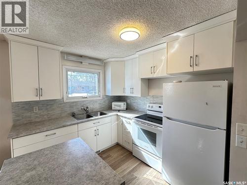 44 Campbell Place, Clavet, SK - Indoor Photo Showing Kitchen With Double Sink
