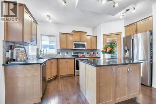 360 Parkmere Green, Chestermere, AB - Indoor Photo Showing Kitchen With Stainless Steel Kitchen