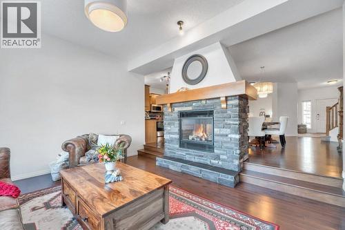 360 Parkmere Green, Chestermere, AB - Indoor Photo Showing Living Room With Fireplace